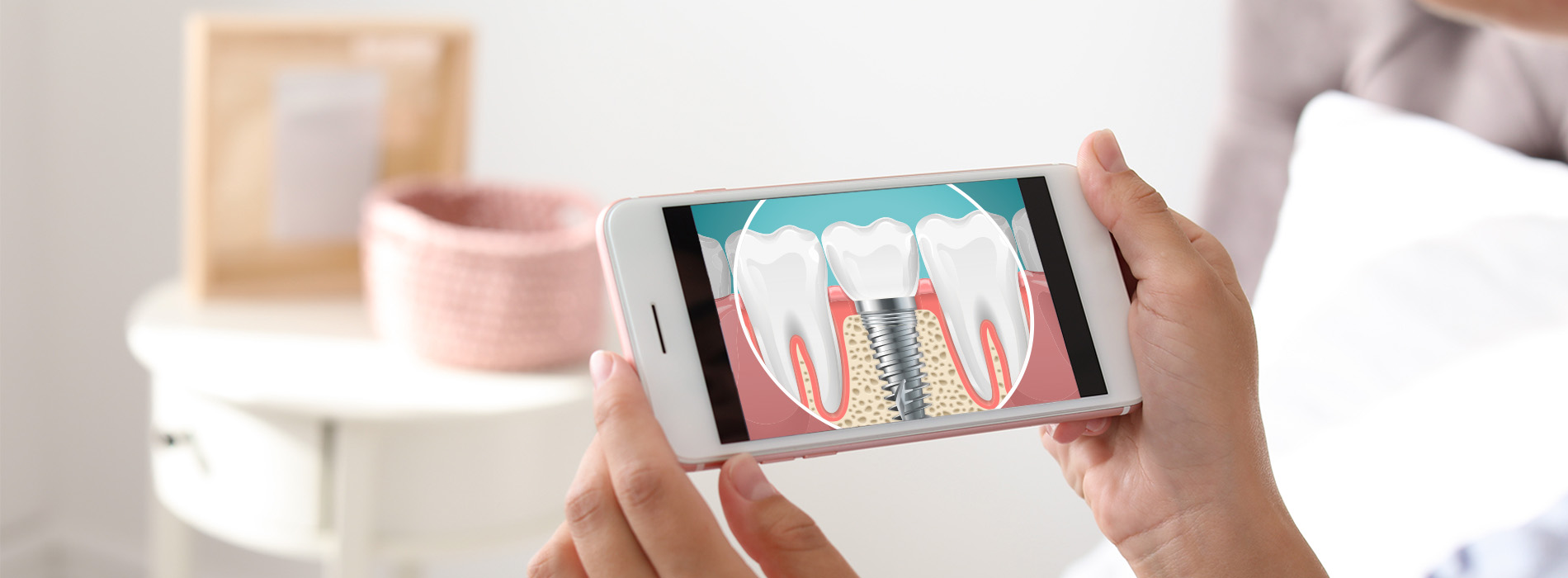 The image shows a person holding a smartphone displaying an app with a toothbrush graphic, indicating oral hygiene or dental care.